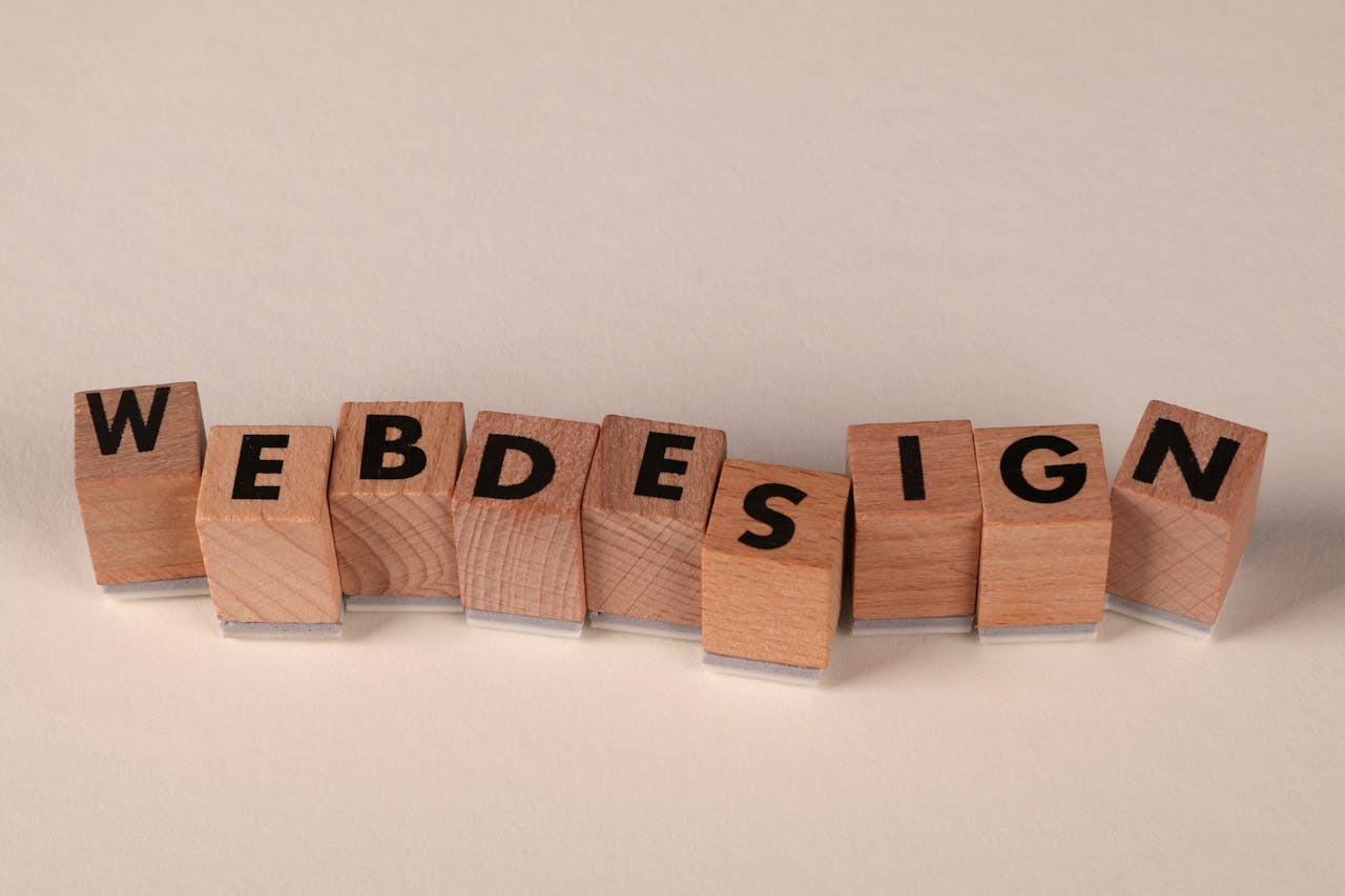 gallery-6 Wooden blocks spelling web design creatively showcase digital design concept.