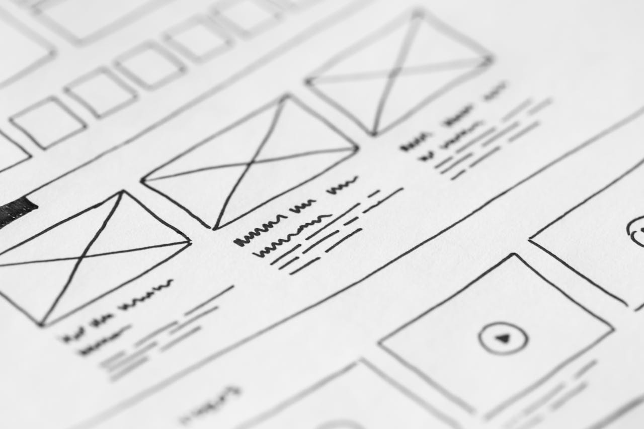about-01 Detailed close-up of a hand-drawn wireframe design on paper for a UX project.